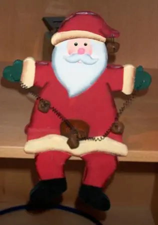 Wooden decorative candle holder in the shape of Santa Claus