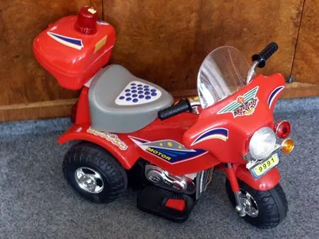 Electric children's tricycle with adaptor
