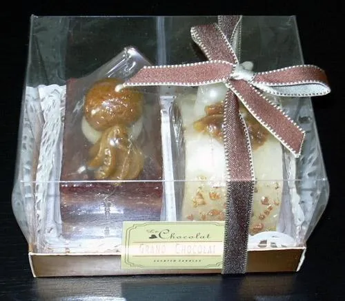 Candle imitating pastry of different shapes (roll, slices) with a chocolate scent
