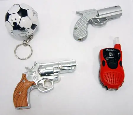Novelty gas lighters in the shape of a black and white football