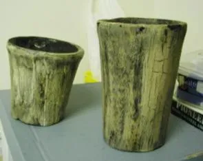 Three wood effect candles in the shape of flower pot