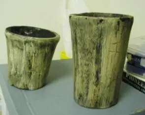 Three wood effect candles in the shape of flower pot