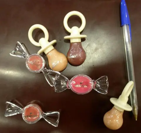 Lipsticks in the form of sweets and dummies.