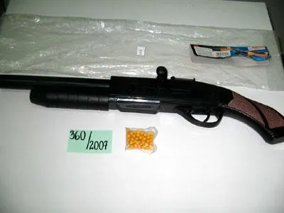Toy ball gun with laser