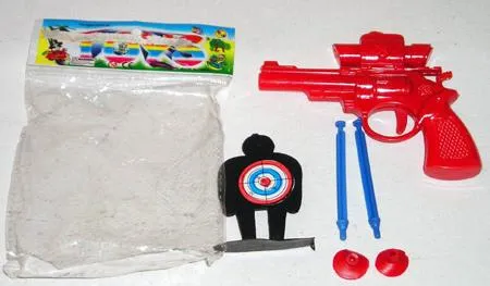 Plastic toy gun with 2 bullets fitted with suckers and target fixed to plastic figures
