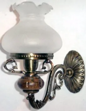 Ornate wall metal bracket with glass cover