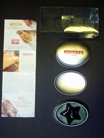 Pernod Ricard candle - a mini tin box containing a gel candle with gel around the wick