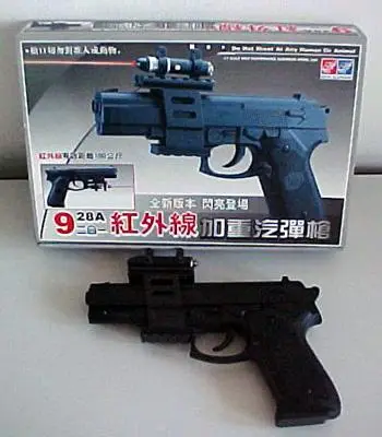 Plastic gun with laser pointer