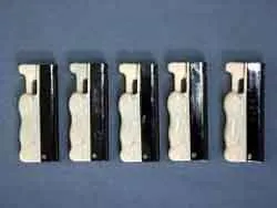 Plastic gas lighter “DORA” depicting a figure of a kneeling woman