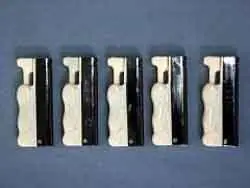 Plastic gas lighter “DORA” depicting a figure of a kneeling woman