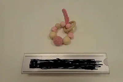 Toy with wooden teether