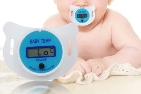 Babies' soother with thermometer