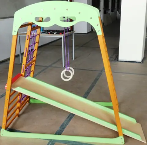Climbing tower with slide