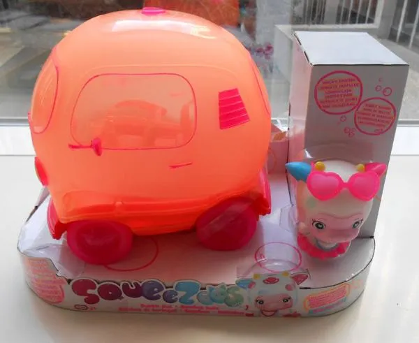 Plastic bus with squeezable toy