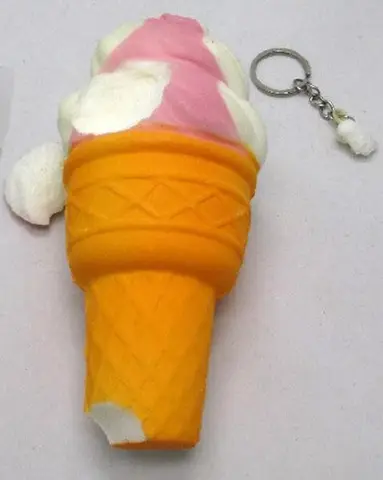 Key ring with squeezable toy
