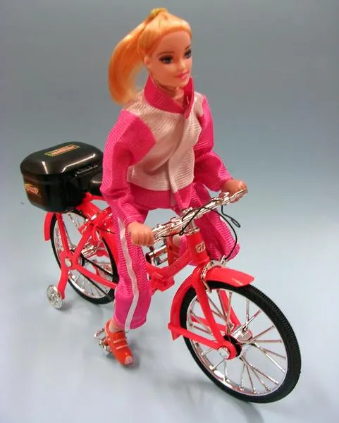Plastic doll on a bicycle