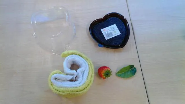 Towel with decorative strawberry